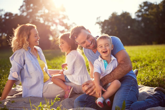 Young,Family,With,Children,Having,Fun,In,Nature